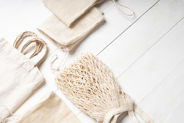 Fototapeta na wymiar Eco-friendly cotton bags on white background