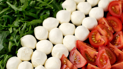 caprese salad. ingrediens for Italian salad caprese as Italian flag. Healthy food concept