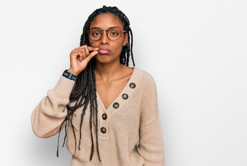 African american woman wearing casual clothes mouth and lips shut as zip with fingers. secret and...