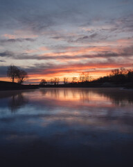 beautiful sunrise over the lake outside the city