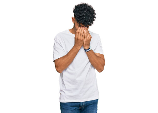 Young arab man wearing casual white t shirt rubbing eyes for fatigue and headache, sleepy and tired expression. vision problem