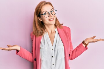 Young caucasian woman wearing business style and glasses smiling showing both hands open palms, presenting and advertising comparison and balance