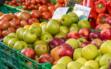 Farmers market, red and green apples, fresh and colorful.