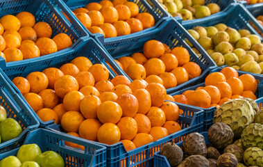 Oranges on display at farmers market, for sale, fresh and healthy food.