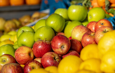 Farmers market, red and green apples, fresh and colorful.