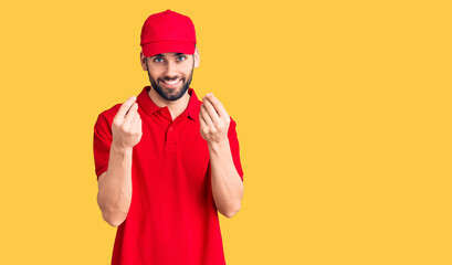 Young handsome man with beard wearing delivery uniform doing money gesture with hands, asking for salary payment, millionaire business