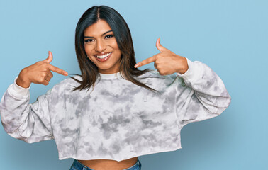 Young latin transsexual transgender woman wearing casual clothes looking confident with smile on...