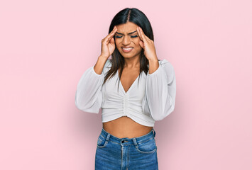 Young latin transsexual transgender woman wearing casual clothes with hand on head, headache because stress. suffering migraine.