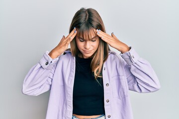 Teenager caucasian girl wearing casual clothes with hand on head, headache because stress. suffering migraine.