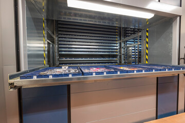 Automated storage system in the warehouse. Vertical carousel storage unit. Beautiful backgrounds. 
