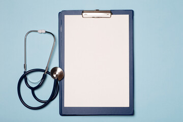 Medical background. White blank tablet on the medical table in the hospital.