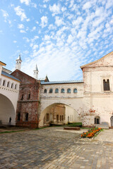 inside the Rostov the Great kremlin under beautiful sky with small clouds