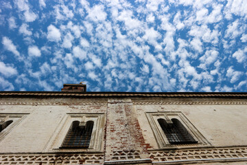inside the Rostov the Great kremlin under beautiful sky with small clouds
