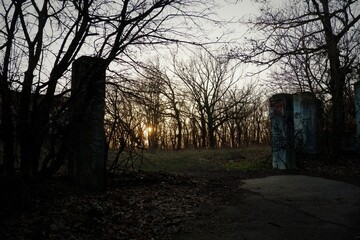 old abandoned cemetery entrance in evening light