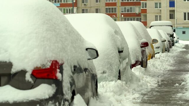 snow covered cars in winter