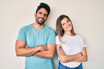 Naklejka premium Beautiful young couple of boyfriend and girlfriend together happy face smiling with crossed arms looking at the camera. positive person.