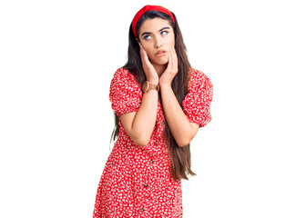 Brunette teenager girl wearing summer dress tired hands covering face, depression and sadness, upset and irritated for problem