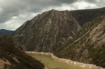 Reservoir in the bed of a river between mountains