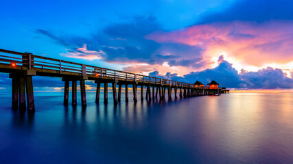 Fototapeta na wymiar Golden hour at Naples Pier, Florida, USA.