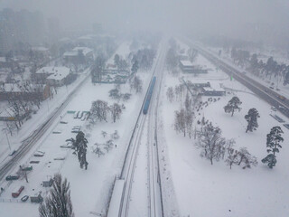 Kiev metro line in a snowstorm. Aerial drone view. Winter snowy morning.