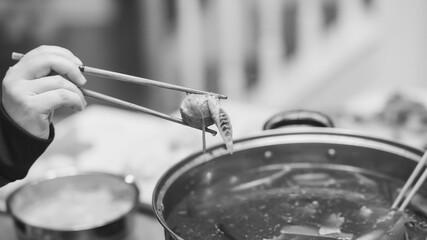 Chopsticks over hot pot dish