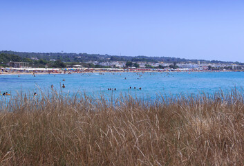 Salento coast: Lido Marini beach, almost sandy and embellished with low cliffs, easy to reach, stretches for more than two kilometres, in the area of the municipalities of Salve and Ugento in Puglia.