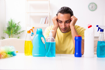 Young male contractor doing housework at home