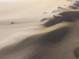 Icy fresh snow mound texture on a winter night