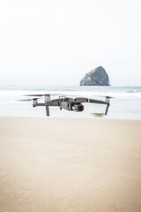 Drone hovering at the beach.