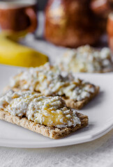 Sandwich with cottage cheese, honey and banana on a diet bread