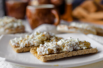 Sandwich with cottage cheese, honey and banana on a diet bread