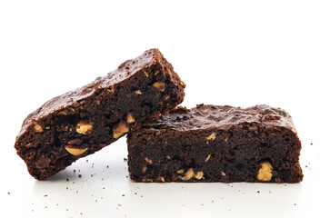 Brownie pieces on white background. Delicious chocolate pie.