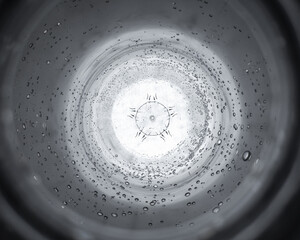 Extreme Close-Up of the Inside of a Water Bottle, with Droplets Surrounding the Inside