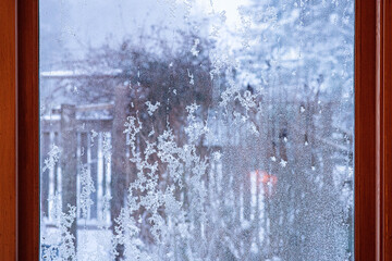 Looking through a frosted window and snowscape