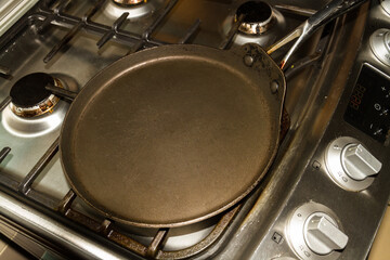 Pancake pan on hob ready for use.