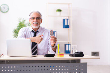 Old sick employee suffering at workplace