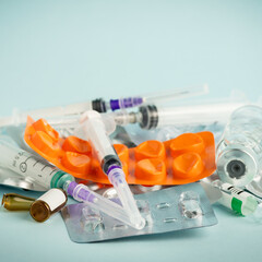 Empty medication blisters, used syringes and ampoules