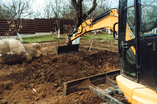 construction works with excavator doing some digging and earth moving