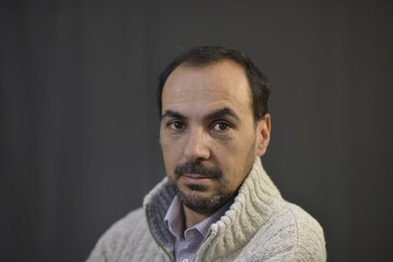 Obraz premium Spanish man with black hair and woolen clothes