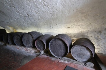 old wine barrels in an ancient cellar