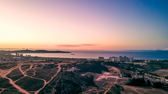 Aerial sunset shot of the sea avenue towards coquimbo, chile, drone