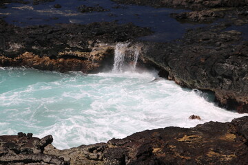 waves crashing on rocks