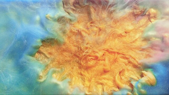 Color explosion. Ink splash in water. Smoke cloud motion. Bright orange fume blast center opener effect in blue glitter mist animation abstract art background.