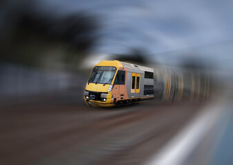 Obraz na płótnie Canvas Radial motion blur Commuter Train approaching Belmore Station in Sydney NSW Australia