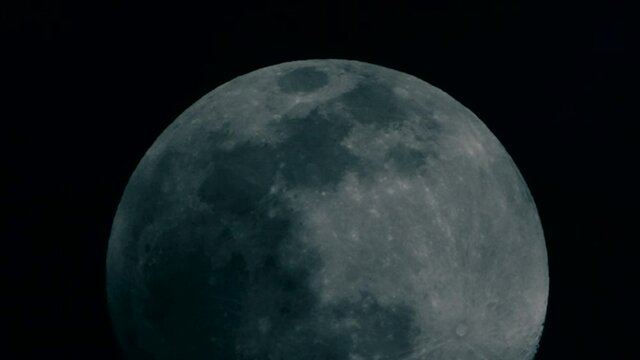 Clouds Passing At Full Moon Rising At The Night Sky. - close up