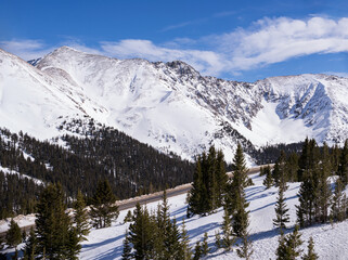 Late January view of the the snow covered mountains that rise above Colorado Highway 6 on Loveland Pass, which goes over the Continental Divide. 
