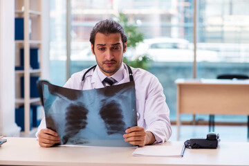 Young male doctor radiologist working in the clinic
