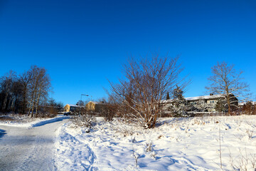 Nice view over an urban area during the winter. Plenty of snow and a clear blue sky. Stockholm, Sweden, Europe.