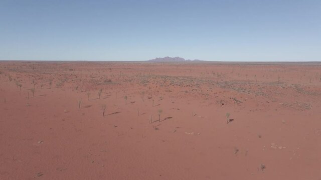 Red Desert Landscape In Uluru-Kata Tjuta National Park. Mount Olga In Distant Background. Northern Territory, Australia. aerial, wide shot