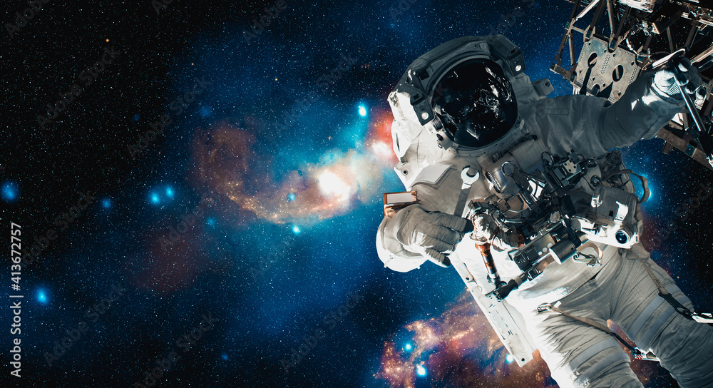 Canvas Prints astronaut spaceman do spacewalk while working for space station in outer space . astronaut wear full
